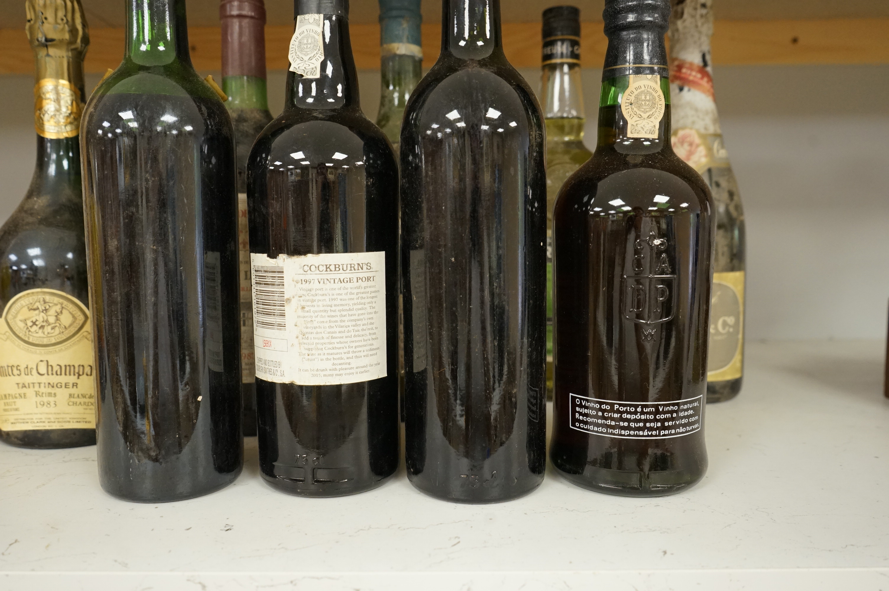 Eleven various bottles of port and wine to include; Cockburns 1997, Chateau Malescot St Exupéry Margaux, etc.